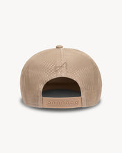 Load image into Gallery viewer, Back of beige trucker hat with small logo embroidered in the center.