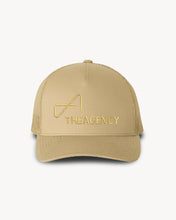 Load image into Gallery viewer, A beige trucker hat with 'THEAGENCY' logo embroidered in the center.