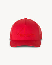 Load image into Gallery viewer, A red trucker hat with 'THEAGENCY' logo embroidered in white on the front.