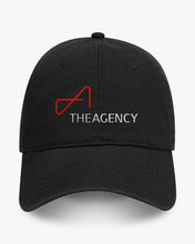 Load image into Gallery viewer, A black baseball cap with a velcro back closure, featuring a white and red logo that reads 'THEAGENCY'.