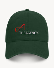 Load image into Gallery viewer, A green baseball cap, featuring a white embroidered logo that reads 'THEAGENCY'.